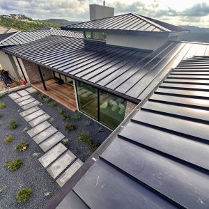 Balcones Roofing & Remodeling24-Gauge 1.5" Standing Seam Metal & Fascia Cladding in Matte Black - Austin, Texas