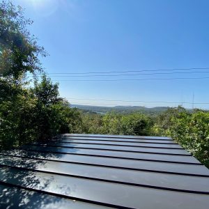 Balcones Roofing & Remodeling24-Gauge 1" Standing Seam Metal Roofing in Berridge Dark Bronze -West Austin, texas